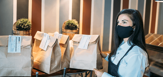 Restaurant employee preparing virtual restaurant orders