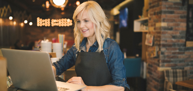 restaurant owner working on her digital restaurant marketing strategy