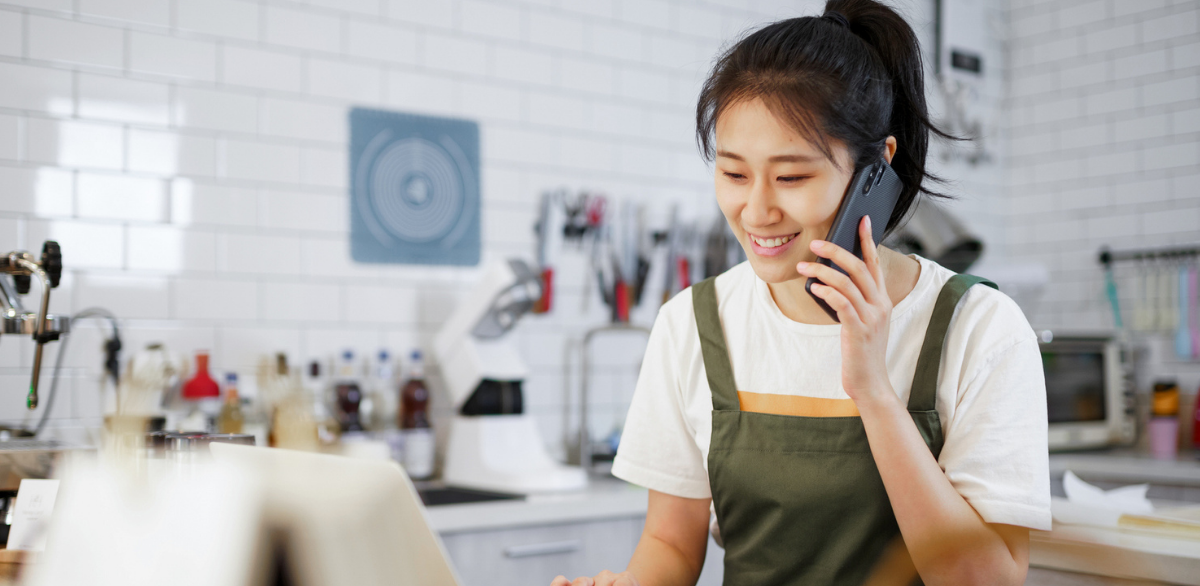 restaurant owner taking an order over the phone