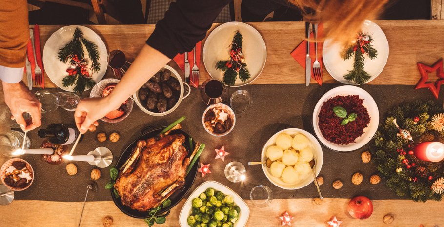 a group of friends gathering for a holiday meal they ordered from a local takeout restaurant that offered holiday restaurant promotions